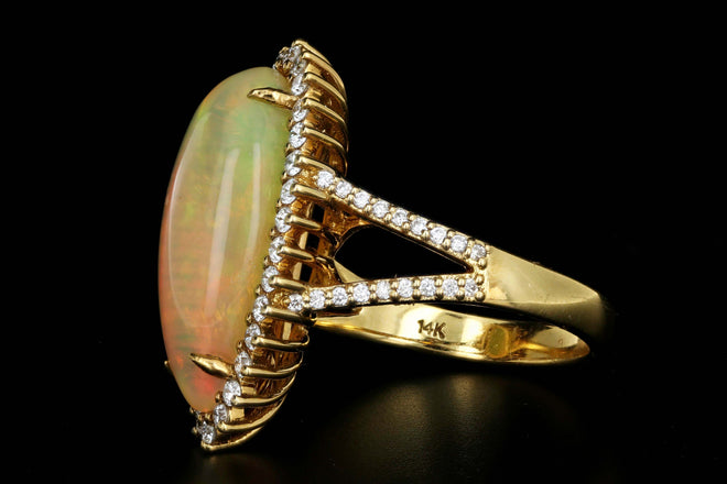 14K Yellow Gold 8.5 CT Ethiopian Opal with .75CTW Diamond Halo Ring - Queen May