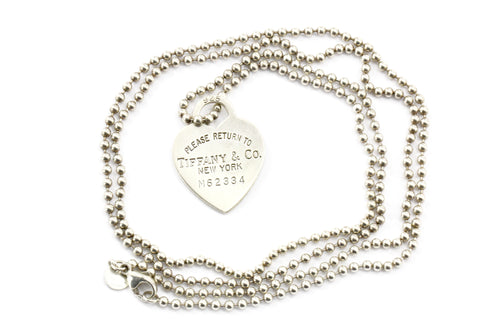 Return to Tiffany™ small heart tag in sterling silver on a bead necklace.