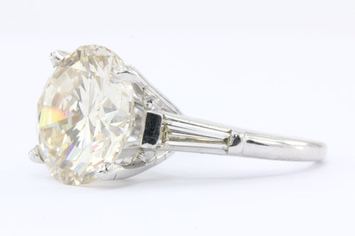 Platinum 7.08 Carat Round Brilliant Diamond Diamond with Tapered Baguettes Ring - Queen May