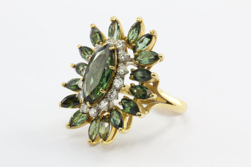 A 18k natural green tourmaline and diamond ring featuring 6.44 carats tw with laboratory appraisal - Queen May