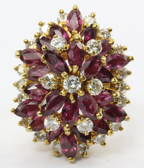 An 18k natural ruby and diamond cocktail ring featuring 5 carats of rubies and 1 carat of diamonds. - Queen May